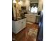 Charming kitchen with an island, stainless steel appliances and cream colored cabinetry at 2000 Howson Rd, Raleigh, NC 27603