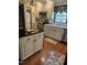 Charming kitchen with an island, stainless steel appliances and cream colored cabinetry at 2000 Howson Rd, Raleigh, NC 27603