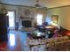 Living room features a fireplace, cozy seating, and natural light with an exit door at 2000 Howson Rd, Raleigh, NC 27603