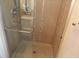 Modern shower featuring glass door, chrome hardware, and tiled walls at 2000 Howson Rd, Raleigh, NC 27603