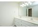 Bright bathroom with double sinks, white cabinets, and large mirror at 201 E Laramie Dr, Mebane, NC 27302