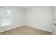 Cozy bedroom with neutral carpet, base molding and natural light at 201 E Laramie Dr, Mebane, NC 27302
