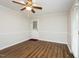 Hardwood floored dining room with a ceiling fan and access to the kitchen at 201 E Laramie Dr, Mebane, NC 27302