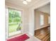 Inviting entryway with tile flooring and view of the living area and landscaped front yard at 201 E Laramie Dr, Mebane, NC 27302