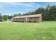 Beautiful single-story brick home with manicured lawn at 201 E Laramie Dr, Mebane, NC 27302