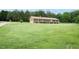 Ranch style home with attached two car garage on a spacious, well manicured lawn at 201 E Laramie Dr, Mebane, NC 27302