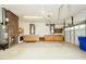 Large garage area with utility hookups, work benches, storage and garage doors at 201 E Laramie Dr, Mebane, NC 27302