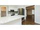 Modern kitchen features granite countertops, stainless steel appliances, and open access to living area at 201 E Laramie Dr, Mebane, NC 27302
