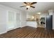 Kitchenette with granite countertops, stainless steel appliances, and access to the dining area at 201 E Laramie Dr, Mebane, NC 27302