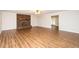 Open-concept living room boasts a brick fireplace and leads to other parts of the home at 201 E Laramie Dr, Mebane, NC 27302