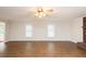 Large living room featuring hardwood floors, neutral paint, and large windows at 201 E Laramie Dr, Mebane, NC 27302