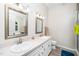 Bright bathroom with double sinks, vanity, and framed mirrors at 203 Needle Park Dr, Cary, NC 27513
