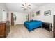 Cozy bedroom with a ceiling fan and hardwood floors at 203 Needle Park Dr, Cary, NC 27513