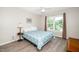 Bright bedroom with a large window and hardwood floors at 203 Needle Park Dr, Cary, NC 27513