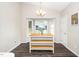 Cozy dining area with bay window and modern chandelier for ample natural light at 203 Needle Park Dr, Cary, NC 27513