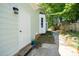 Exterior view of the side of the house with landscaping and entry door at 203 Needle Park Dr, Cary, NC 27513