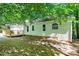 Back exterior showing windows, wood deck and green vinyl siding at 203 Needle Park Dr, Cary, NC 27513