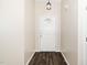 Neutral hallway with updated floors that lead to the front door at 203 Needle Park Dr, Cary, NC 27513