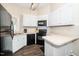 Well-lit kitchen with white cabinets and modern appliances for easy meal prep at 203 Needle Park Dr, Cary, NC 27513