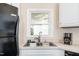Bright kitchen with stainless steel sink and window overlooking the backyard at 203 Needle Park Dr, Cary, NC 27513