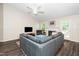 Inviting living room with a comfortable sectional couch and plenty of natural light at 203 Needle Park Dr, Cary, NC 27513