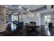 Well-lit common area with seating, foosball, a stone accent wall, and a large window overlooking the community at 204 Seagraves Creek Ln, Holly Springs, NC 27540