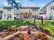 Exterior backyard with a decorative wooden bridge, a manicured lawn, and a pergola at 205 Hammond Wood Pl, Morrisville, NC 27560
