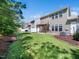 Backyard with healthy lawn and shaded patio area, great for relaxing or entertaining at 205 Hammond Wood Pl, Morrisville, NC 27560