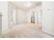 Neutral bedroom with entrances to a closet with laundry and a tiled bathroom at 205 Hammond Wood Pl, Morrisville, NC 27560