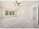 Neutral bedroom featuring lots of natural light from three windows, light carpet, and white trim at 205 Hammond Wood Pl, Morrisville, NC 27560