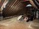 Unfinished attic with exposed wood, visible insulation, and storage potential at 206 Kettlebridge Dr, Cary, NC 27511