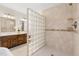 Luxurious primary bathroom with glass block partition separating shower and double vanity at 206 Kettlebridge Dr, Cary, NC 27511