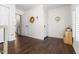 Hallway with hardwood floors and white doors; filled with natural light at 206 Kettlebridge Dr, Cary, NC 27511