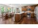 Charming kitchen featuring stainless steel appliances, a center island, and an adjacent breakfast nook with large windows at 206 Kettlebridge Dr, Cary, NC 27511