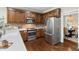 Updated kitchen with stainless appliances, custom cabinetry, and a breakfast nook with natural light at 206 Kettlebridge Dr, Cary, NC 27511