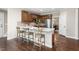 Well-appointed kitchen with breakfast bar seating, custom cabinetry, stainless steel appliances, and a bright, airy atmosphere at 206 Kettlebridge Dr, Cary, NC 27511