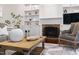 Inviting living room with a brick fireplace, built-in shelving, and stylish decor create a cozy atmosphere at 206 Kettlebridge Dr, Cary, NC 27511