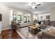 Spacious living room with large windows leading to a screened-in porch providing lots of natural light at 206 Kettlebridge Dr, Cary, NC 27511