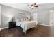 This is a bedroom with wood flooring, a ceiling fan, and a queen size bed at 206 Kettlebridge Dr, Cary, NC 27511