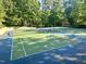Community tennis courts surrounded by lush greenery, perfect for recreational activities at 206 Kettlebridge Dr, Cary, NC 27511
