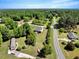 Wide aerial view of a neighborhood with lush greenery, homes, and roads at 2062 Montgomery Dr, Franklinton, NC 27525