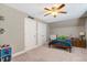 Charming bedroom with plush carpeting, ceiling fan, and bright natural light at 2062 Montgomery Dr, Franklinton, NC 27525
