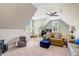 Bright bonus room with sloped ceilings, plush carpet, and lots of light at 2062 Montgomery Dr, Franklinton, NC 27525