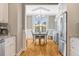 Cozy breakfast nook with hardwood floors, lots of natural light and stainless refrigerator at 2062 Montgomery Dr, Franklinton, NC 27525