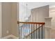 Hallway with a view down to the foyer and features a chandelier and wood banister at 2062 Montgomery Dr, Franklinton, NC 27525