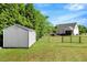Backyard view featuring a storage shed and a fenced yard at 2062 Montgomery Dr, Franklinton, NC 27525