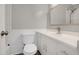 Bathroom showcasing white vanity, mirror and white tiled backsplash at 207 Mcleod Dr, Sanford, NC 27330
