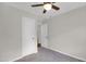 Bedroom featuring neutral walls, carpet, ceiling fan and a closet with doors at 207 Mcleod Dr, Sanford, NC 27330