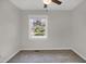 Bedroom with neutral walls, carpet, ceiling fan and window with lake view at 207 Mcleod Dr, Sanford, NC 27330