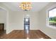 Inviting dining area featuring hardwood floors and a view into the open-concept kitchen at 207 Mcleod Dr, Sanford, NC 27330